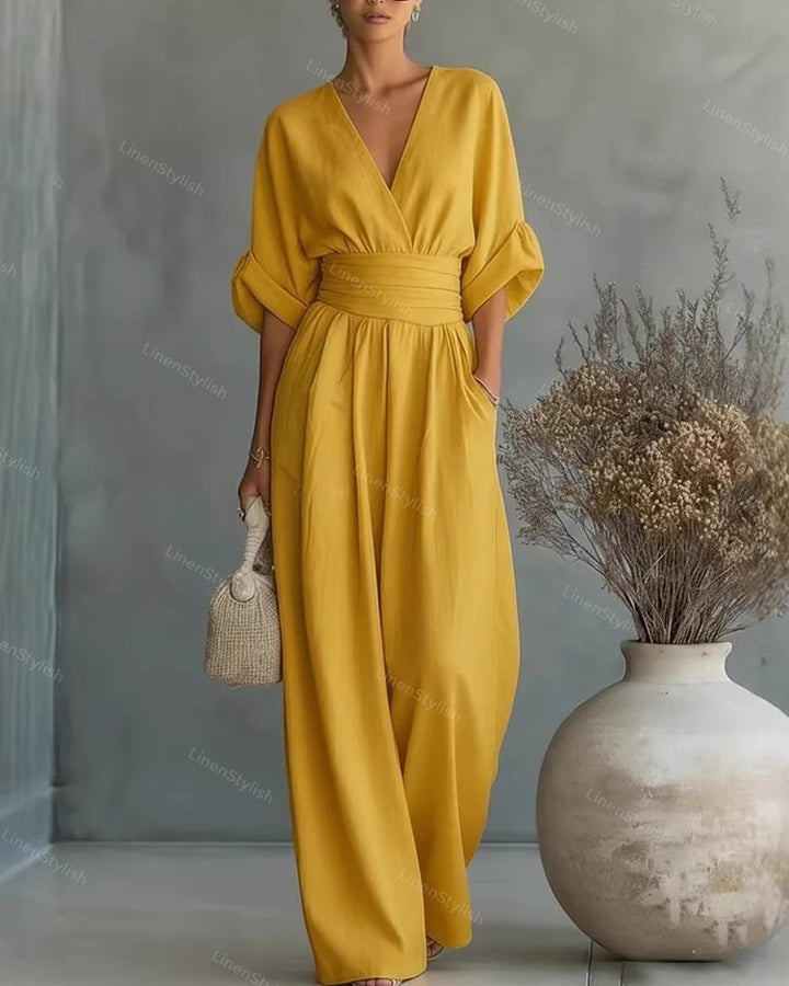 Wijdvallende dames jumpsuit met V-hals en brede tailleband, okergeel