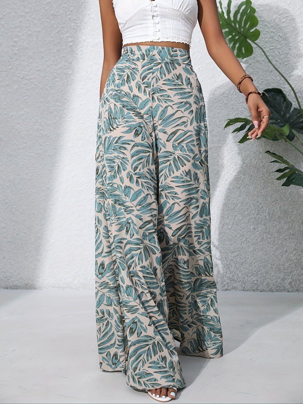 Pantaloni palazzo da donna a vita alta con stampa floreale - Fluidi ed eleganti 0