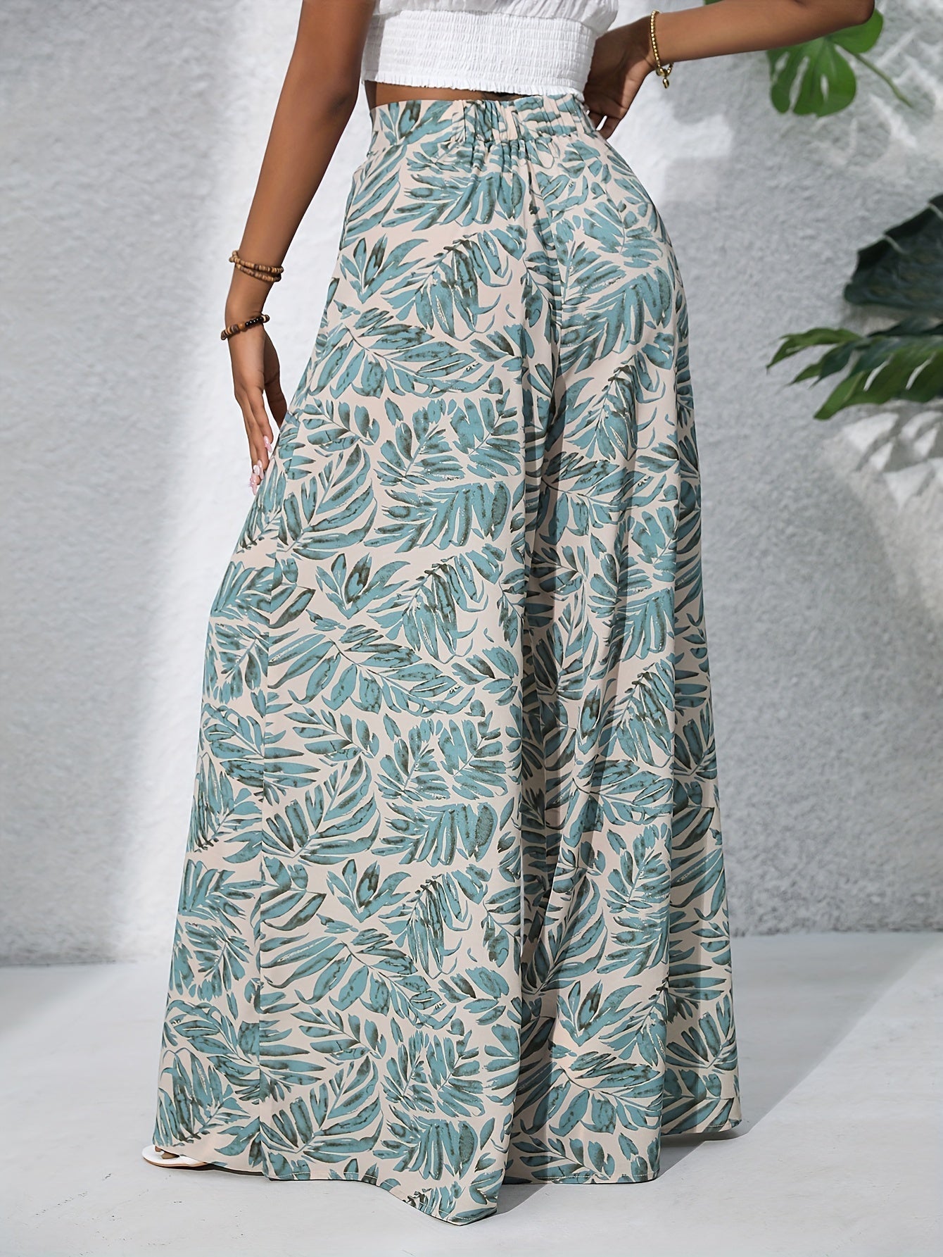 Pantaloni palazzo da donna a vita alta con stampa floreale - Fluidi ed eleganti 1