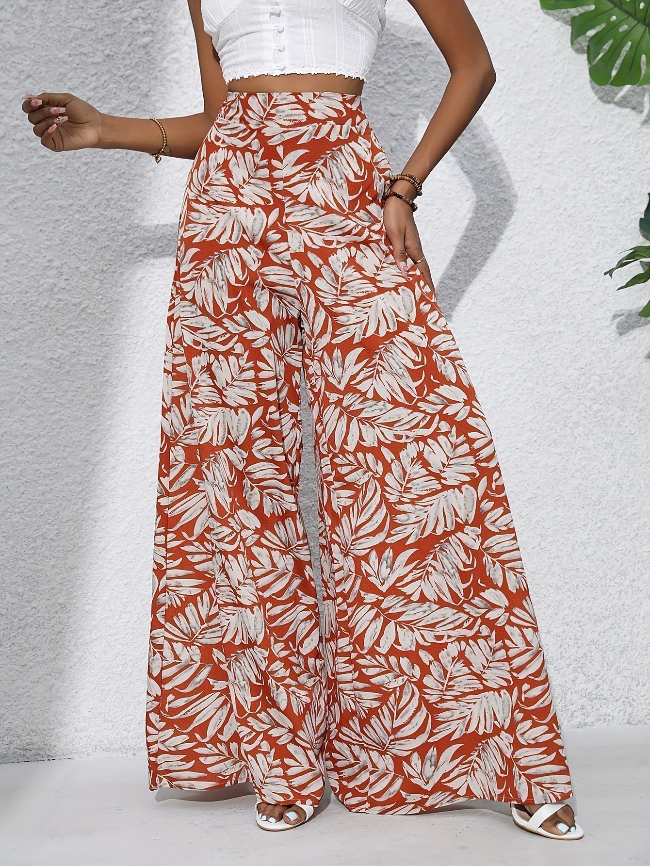 Pantaloni palazzo da donna a vita alta con stampa floreale - Fluidi ed eleganti 4