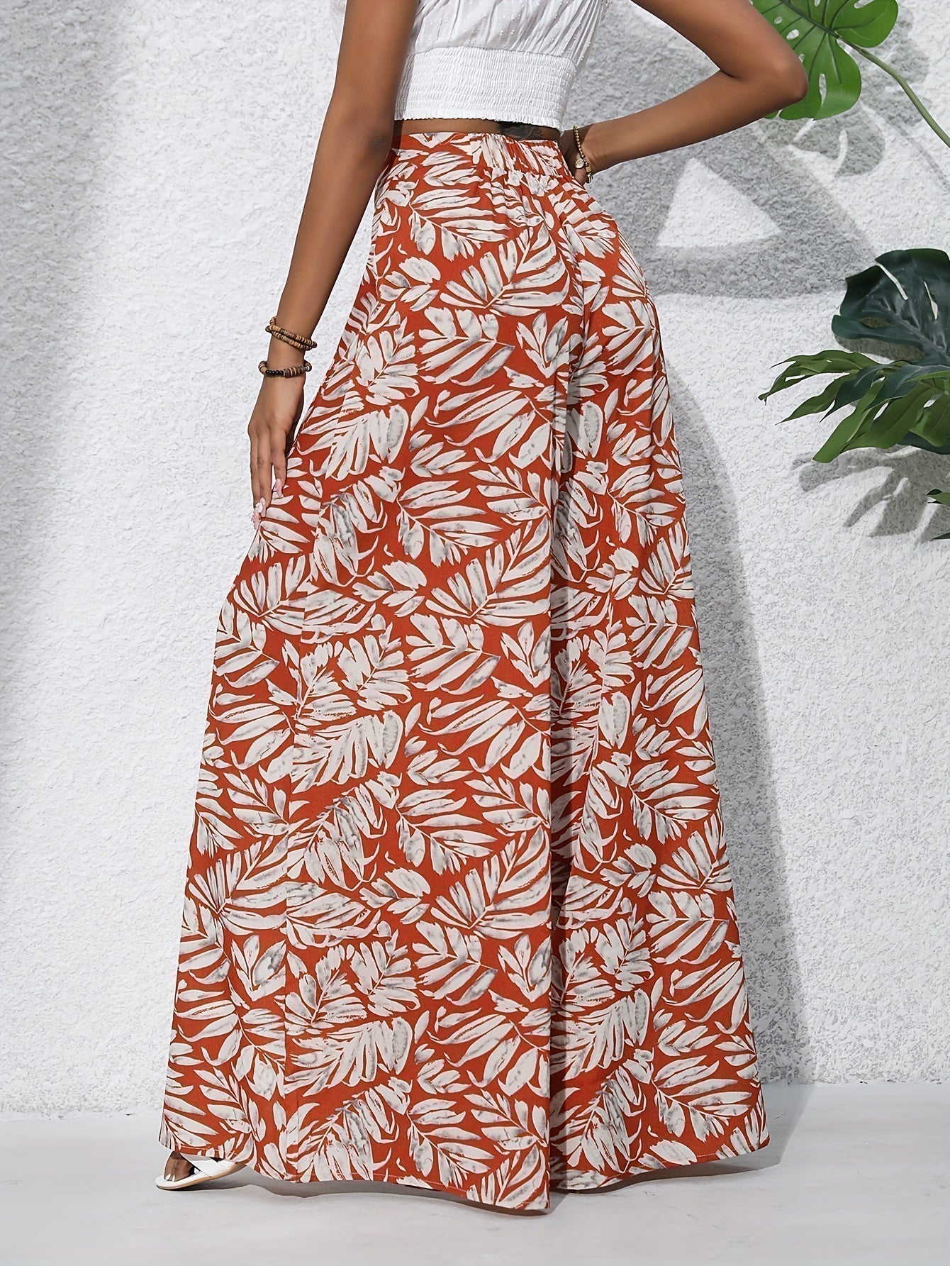 Pantaloni palazzo da donna a vita alta con stampa floreale - Fluidi ed eleganti 5